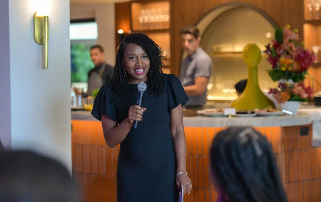 woman speaks to a crowd