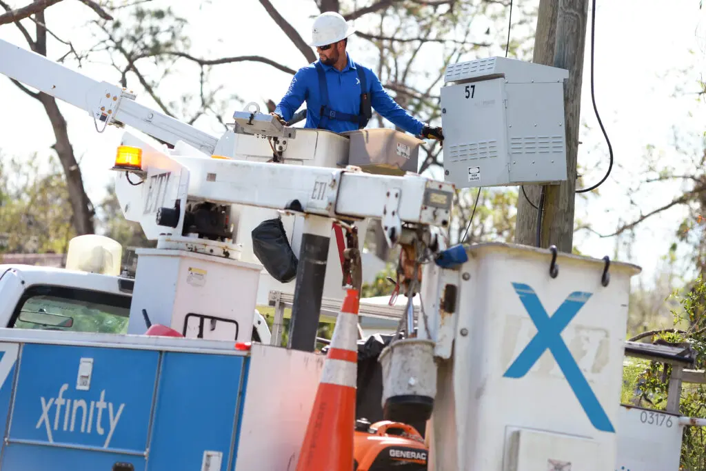 Comcast senior management officials and field service technicians assess damage and make repairs following the destruction caused by Hurricane Helene