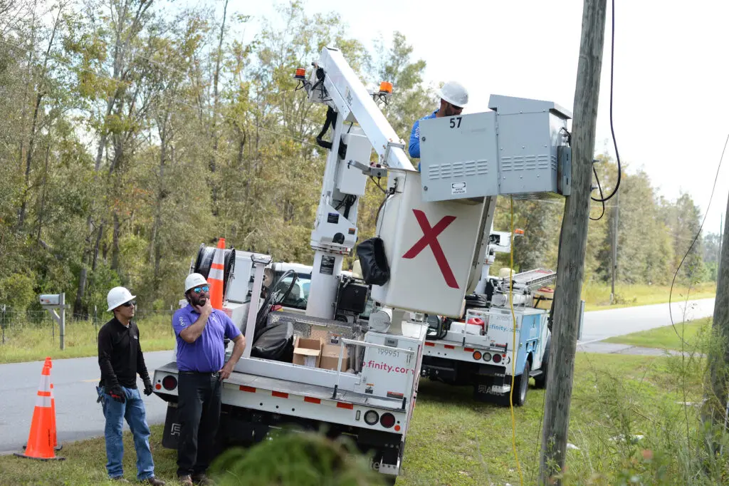 Comcast senior management officials and field service technicians assess damage and make repairs following the destruction caused by storm.