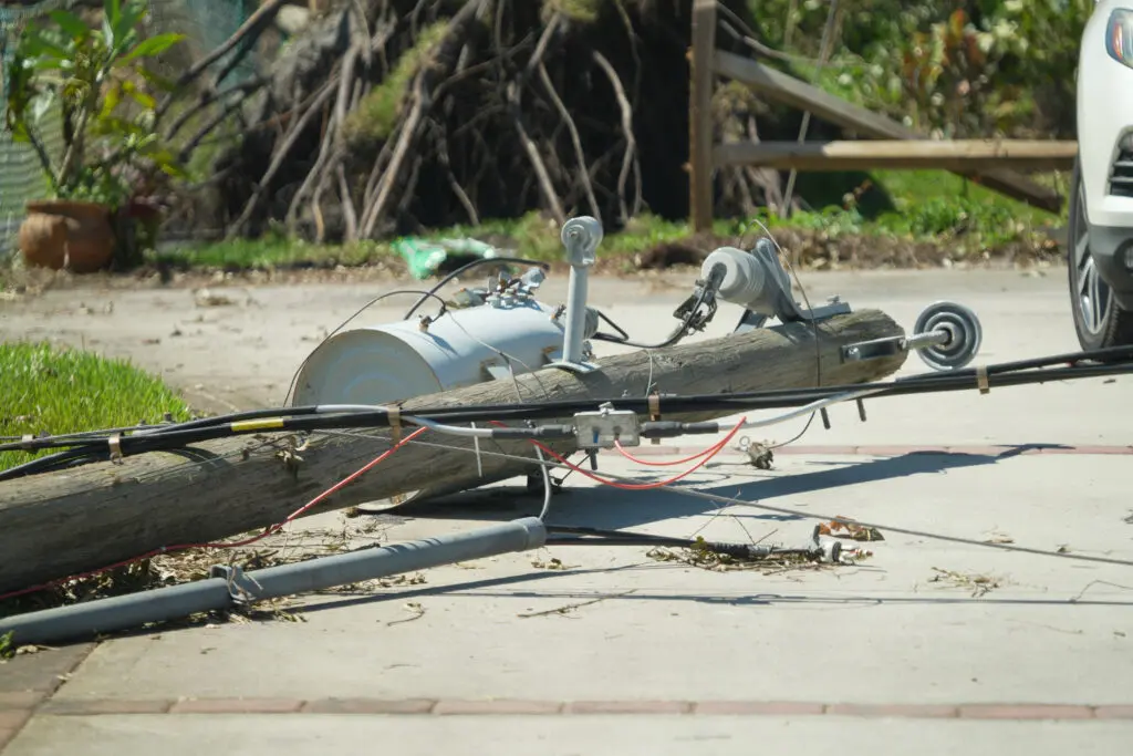 A downed power line lies on the ground post-storm