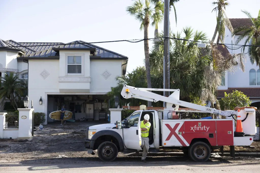 An Xfinity technician arrives to help restore connectivity following hurricane damage.