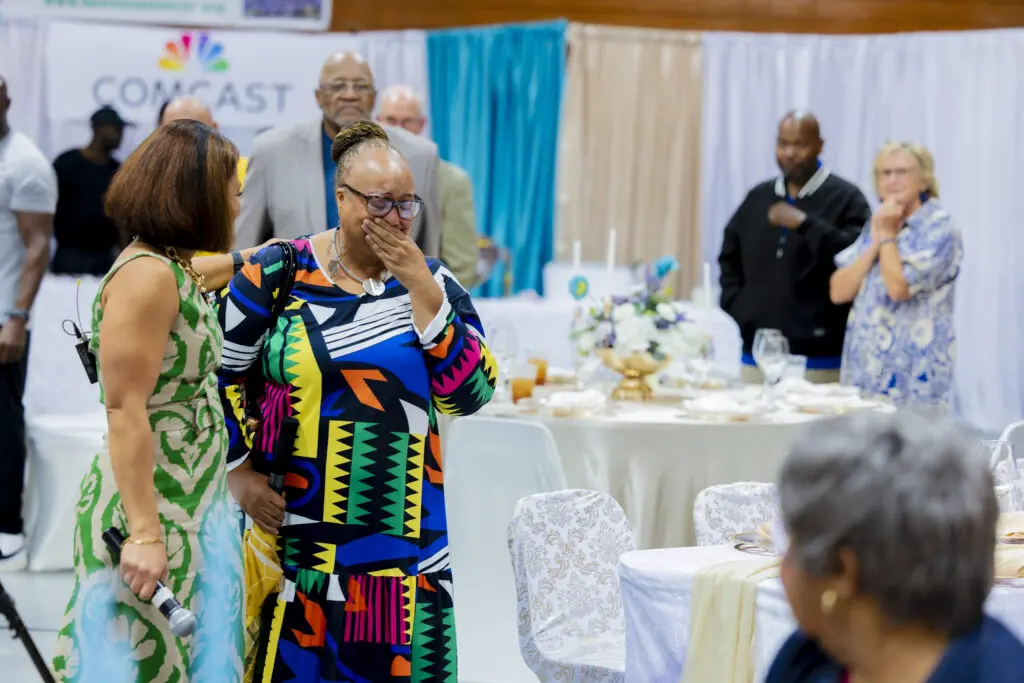 Pearson is surprised by her family and friends at the Champions of Change luncheon.