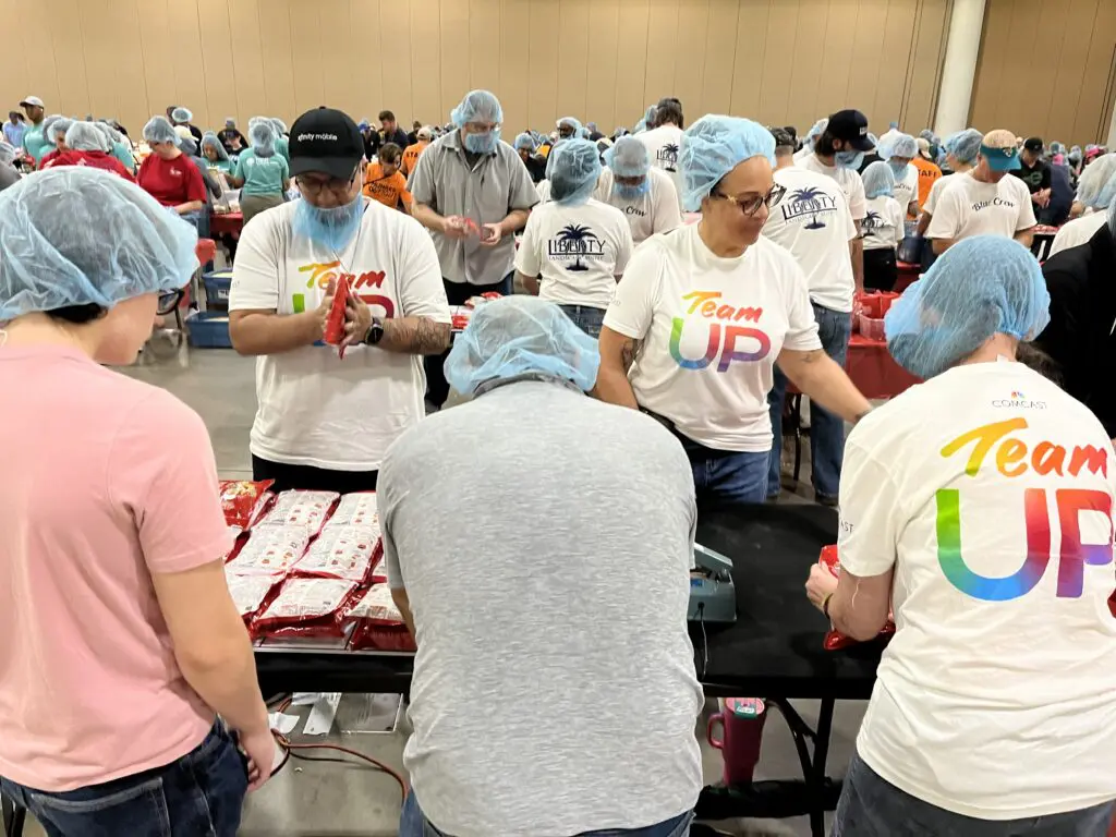 a group of people preparing meals