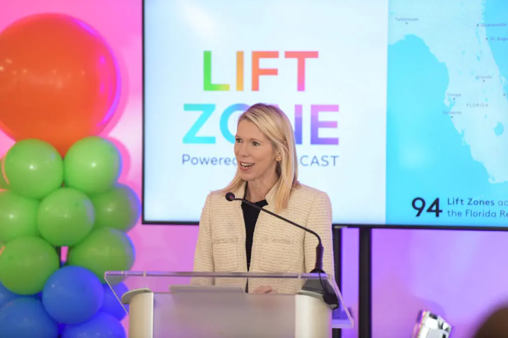 woman speaking at podium