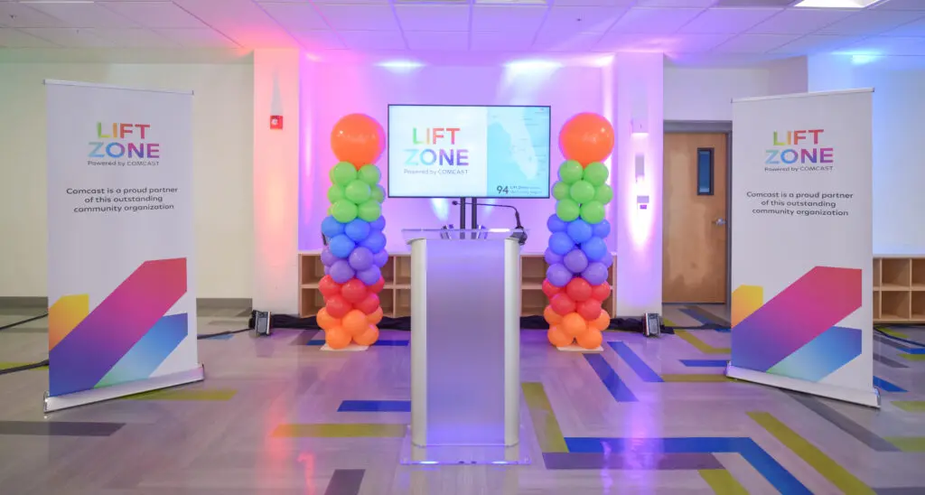 room set up with a podium and ballons