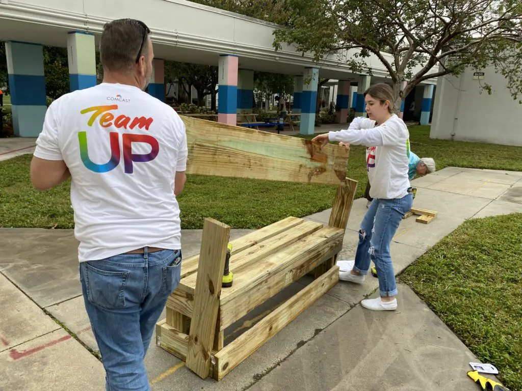 Bobby Singer and his daughter Reagan build a bench for  Dr. Martin Luther King, Jr. Montessori Academy.