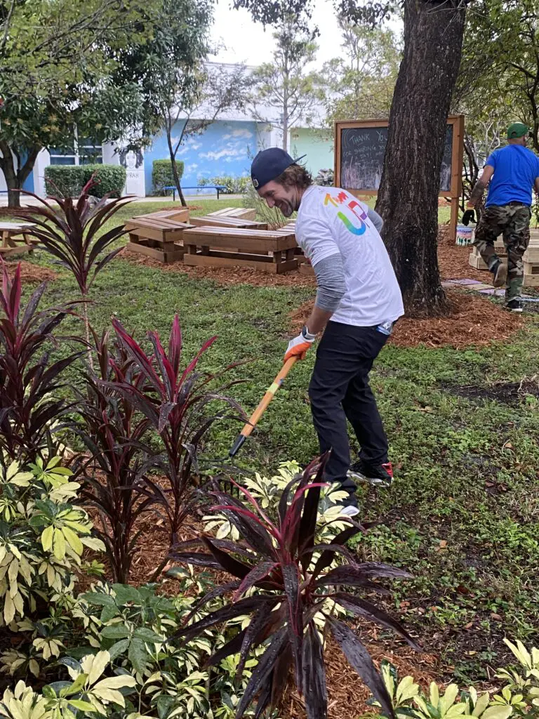 Volunteers work on the school's landscaping.