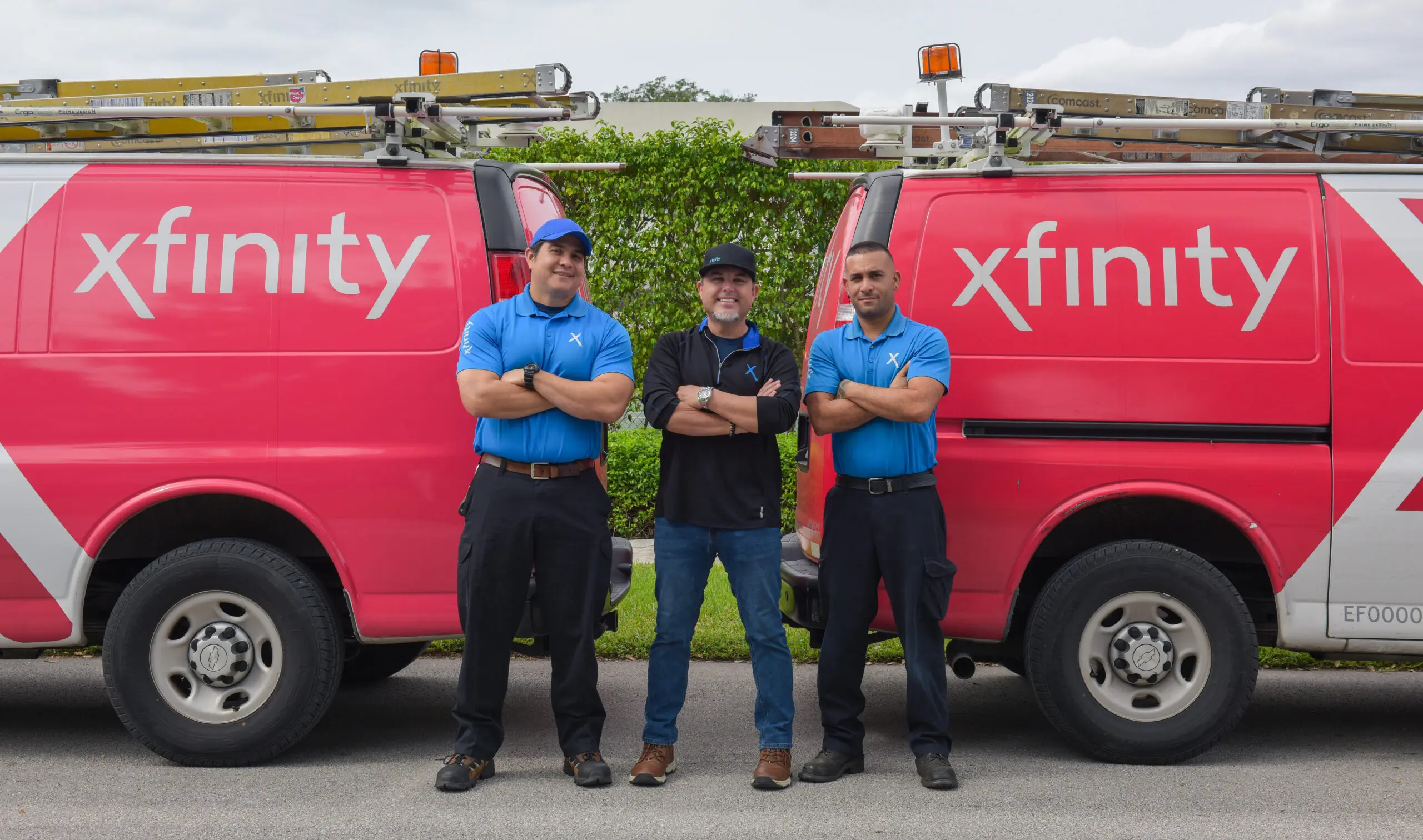 Xfinity techs pose in front of their truck