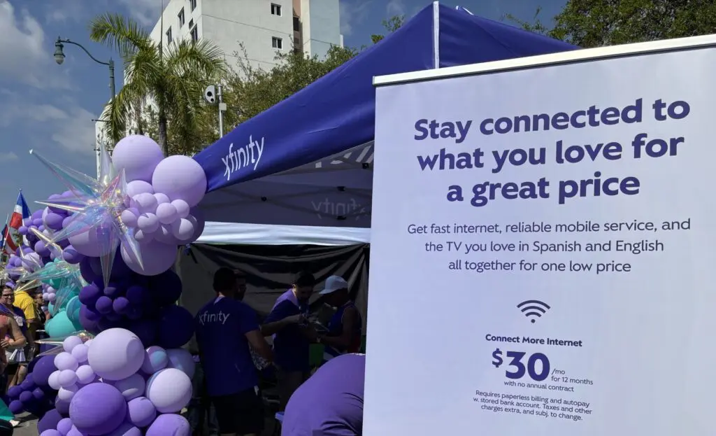 tents with balloons and an ad