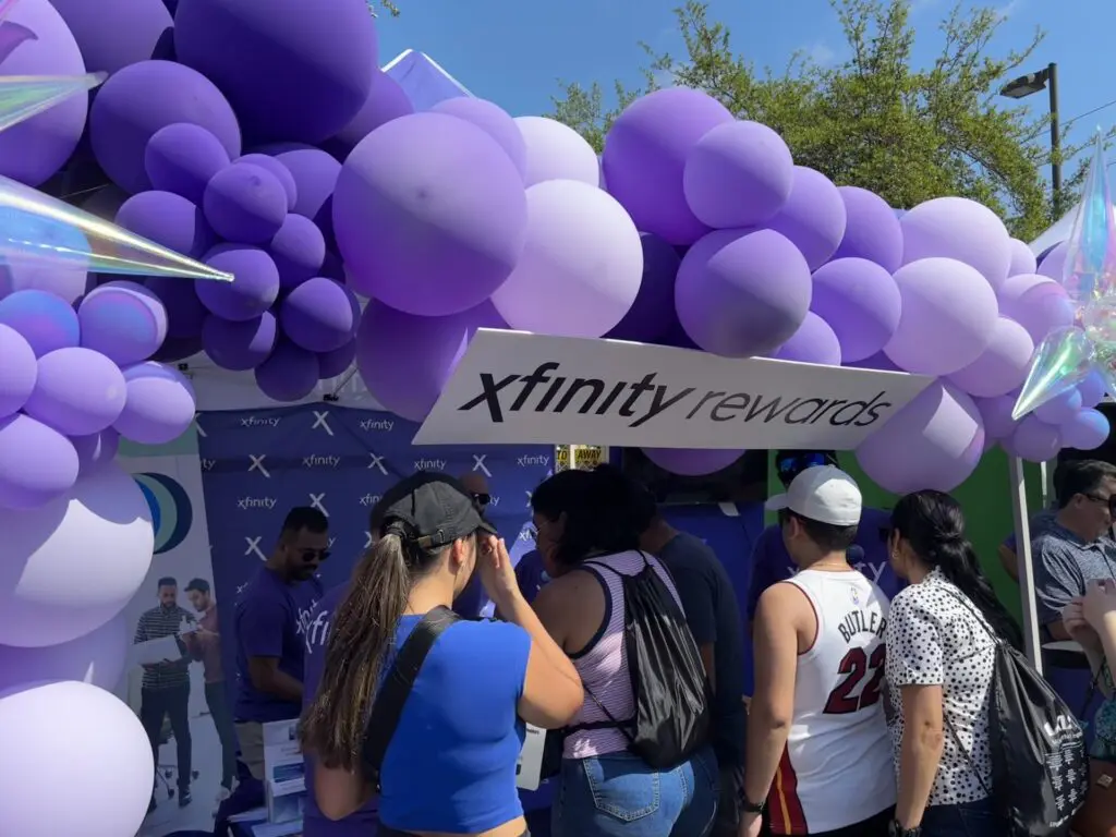 people talking at a booth