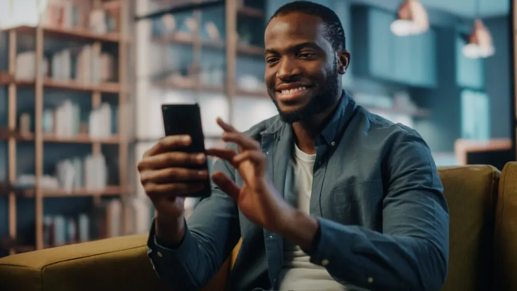 Man spring cleaning apps on his phone