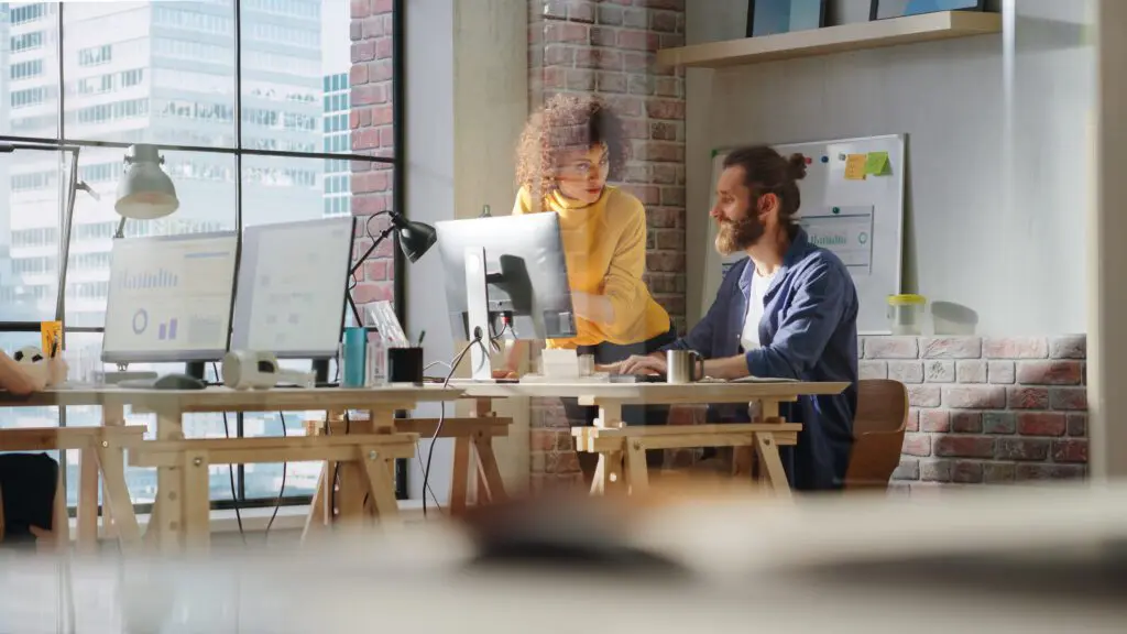 Celebrating small businesses across Florida during Small Business Month. IMAGE: Two people looking at a laptop in an office