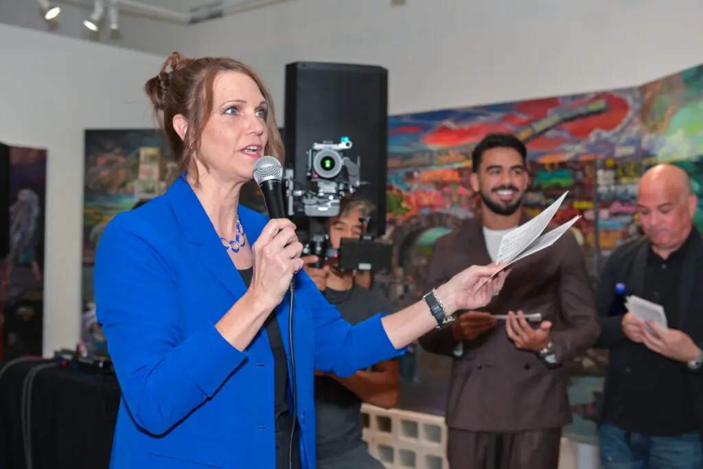 woman giving remarks at event