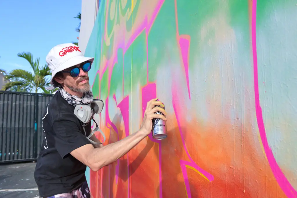 man painting a graffiti