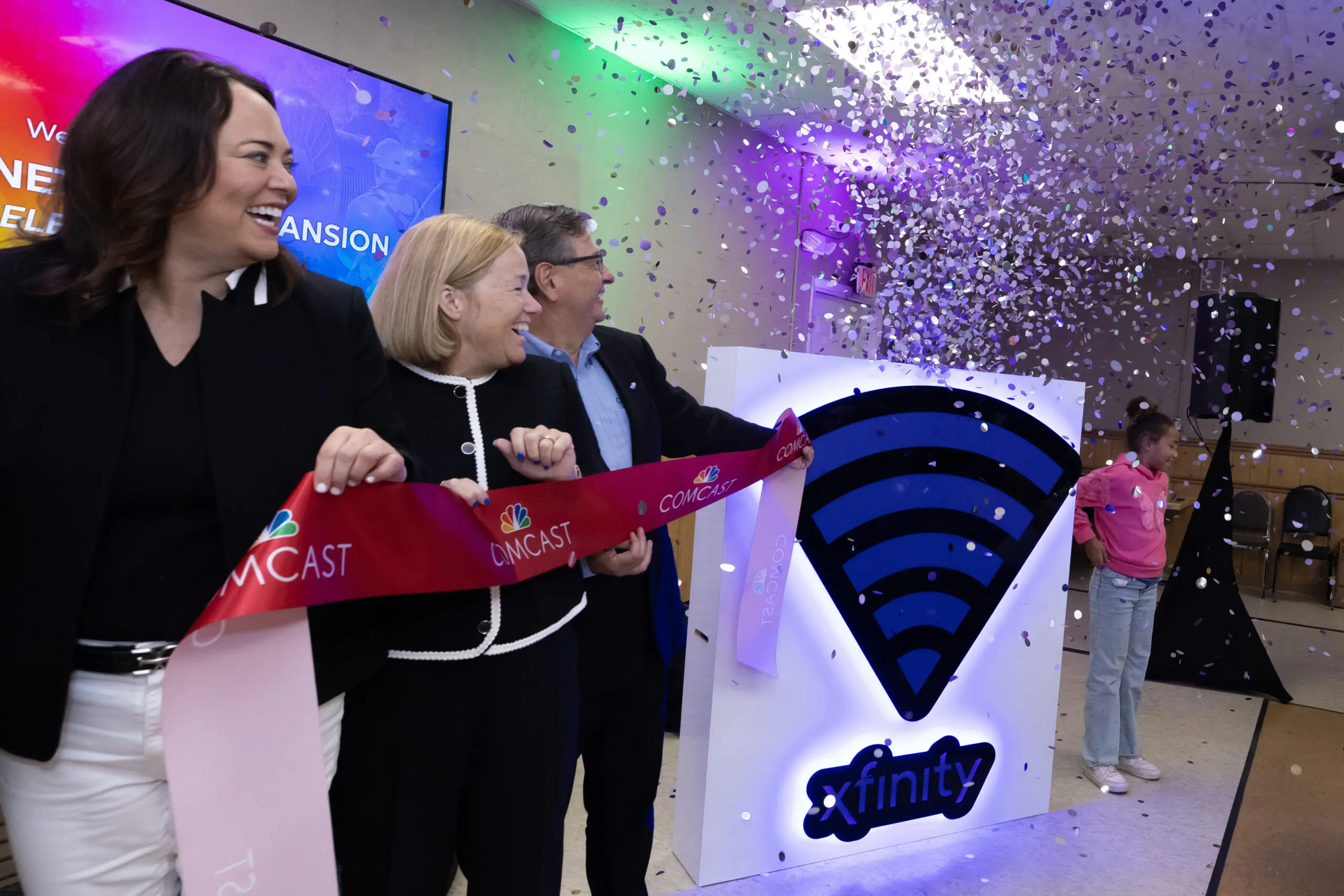 people at a ribbon cutting ceremony