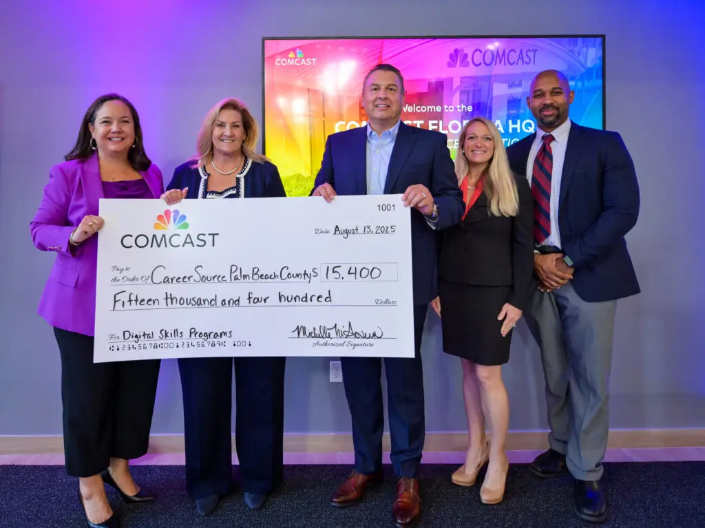 Comcast leaders present CareerSource Palm Beach County with $15k to support digital skills programming.