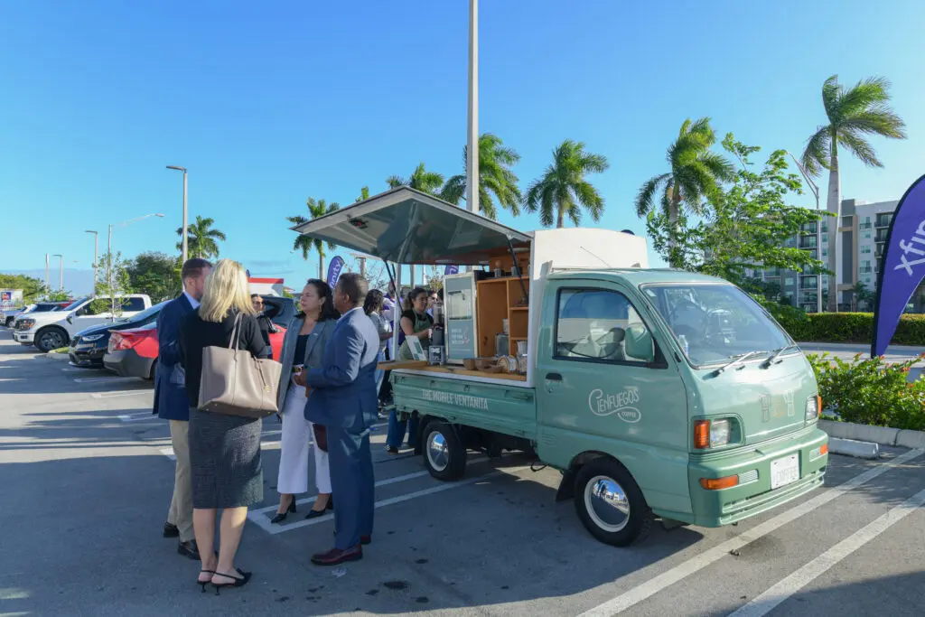 People outside networking and ordering coffee.