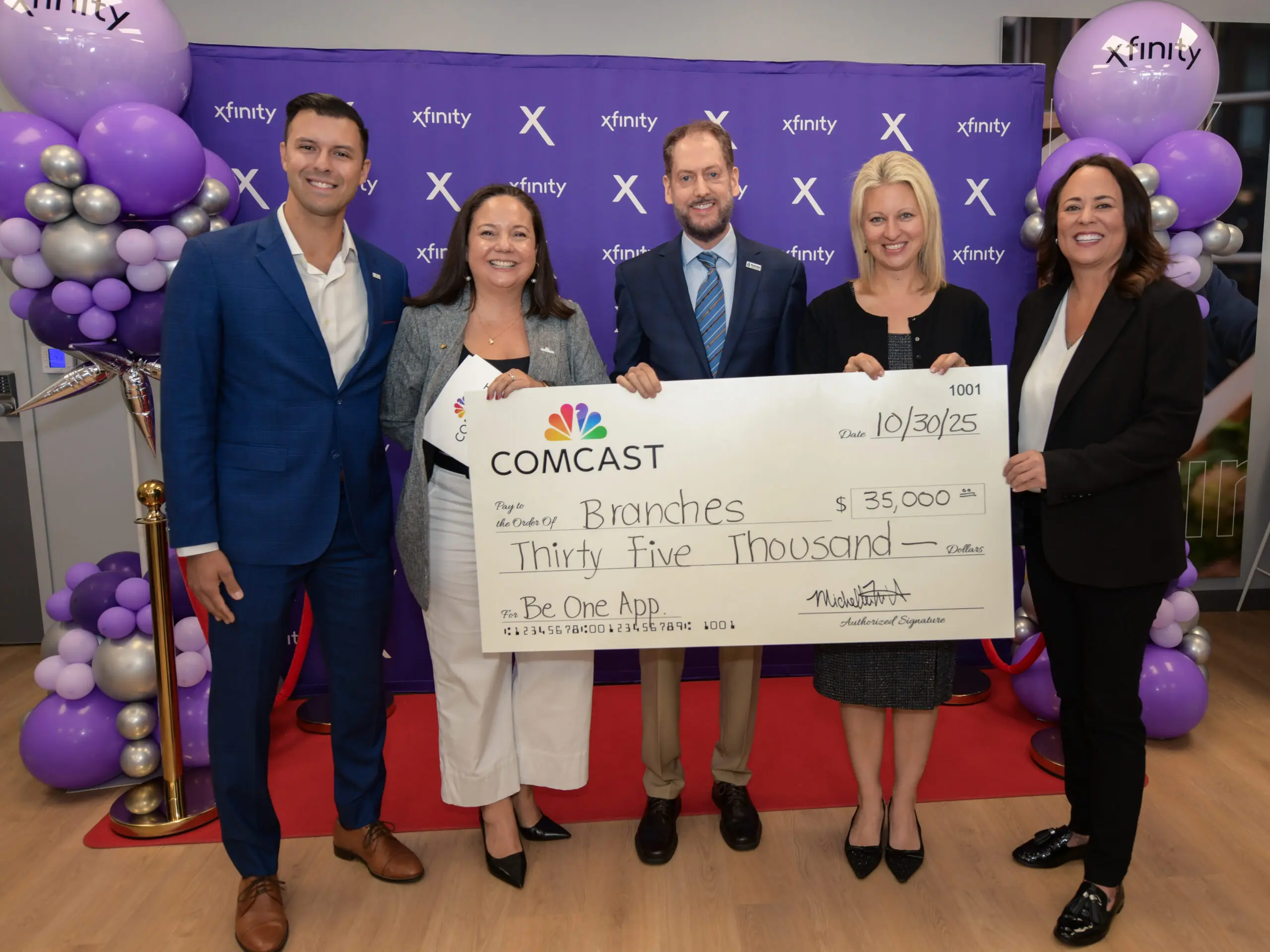 people holding a check