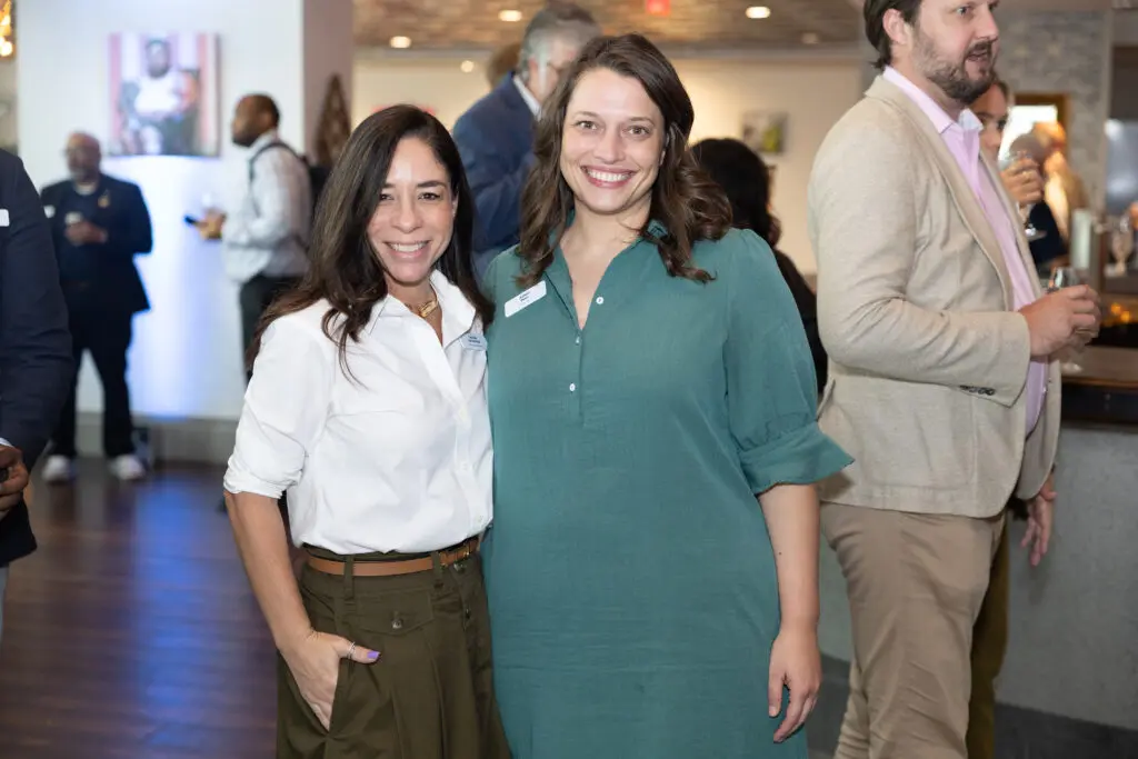 Attendees smile for a photo.