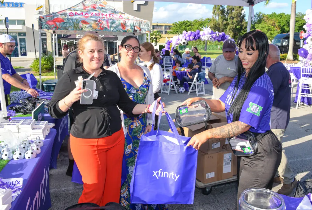 woman handing out souvenirs.