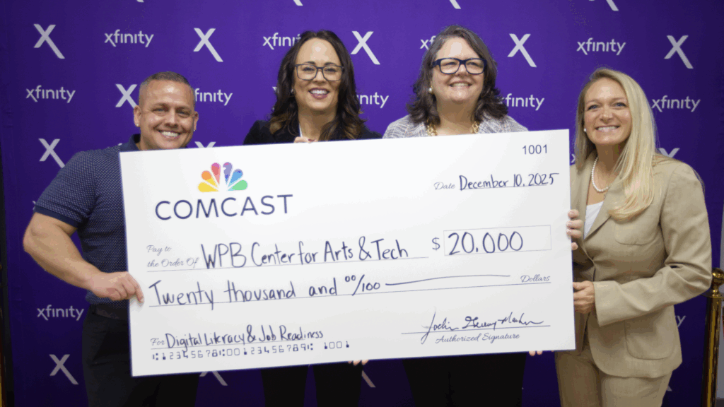 Comcast presents $20,000 grant to West Palm Beach Center for Arts & Technology during Delray Beach Xfinity store opening event.