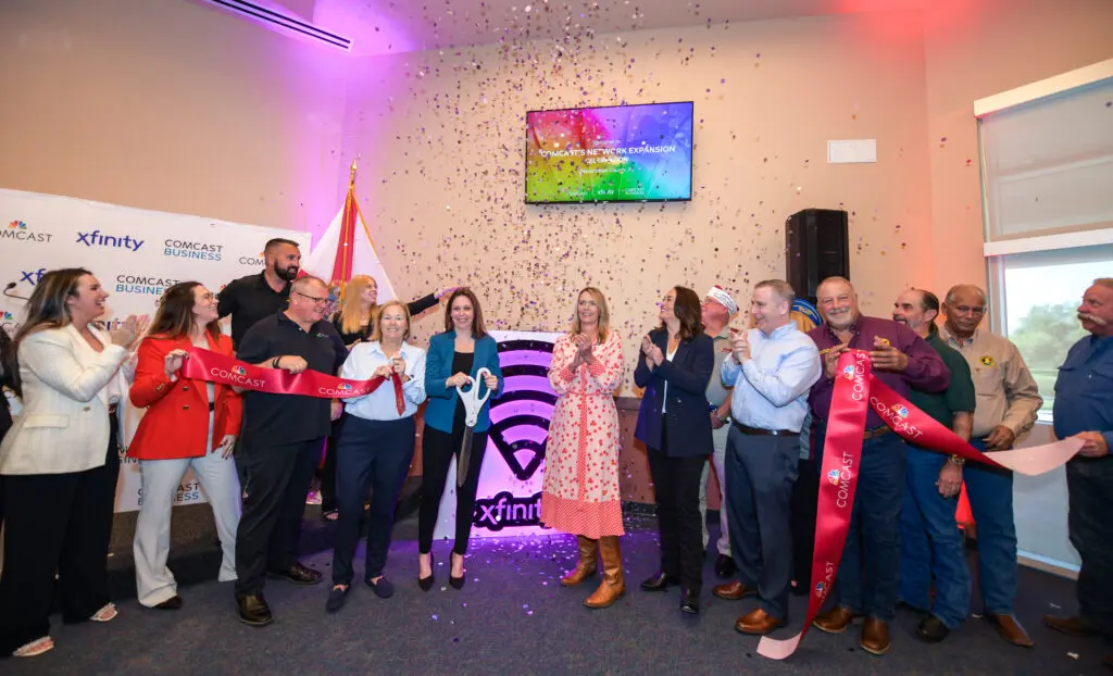 Kristeen Cominiello joins other Comcast leaders for ribbon cutting event in Okeechobee, Florida.