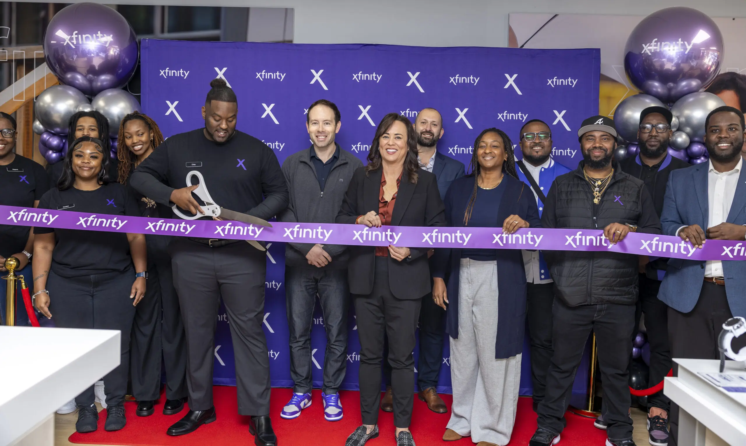 The Xfinity team cuts the ribbon on the new Tallahassee store.