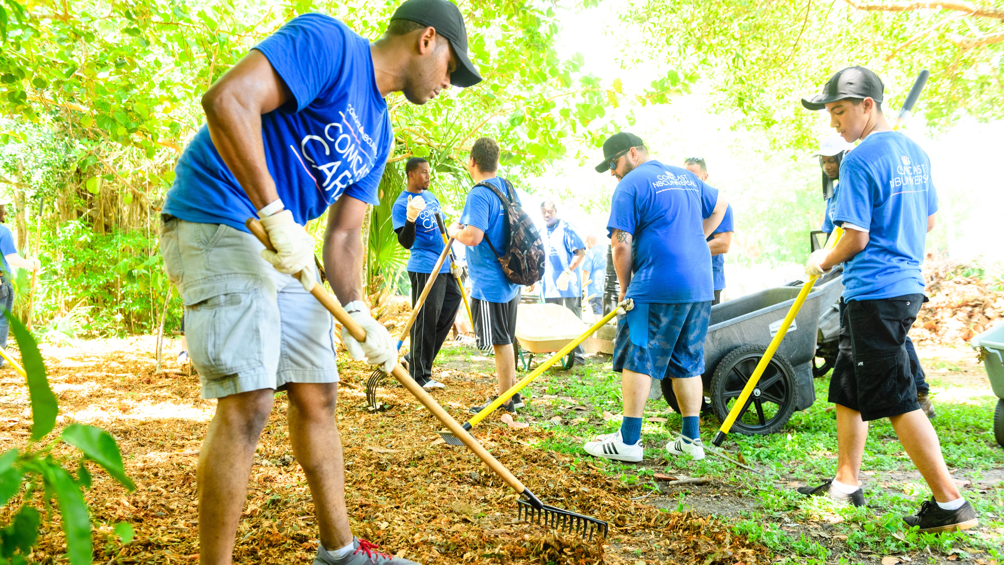 Comcast Cares Day volunteers work in a garden.