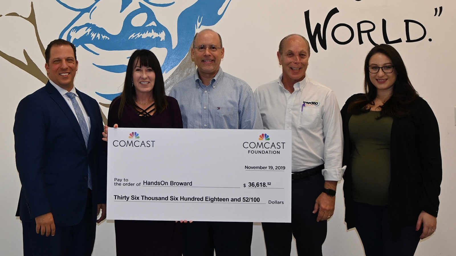 Dawn Stagliano, Director of Government Affairs and Community Impact for Comcast in Broward County, presented HandsOn Broward with a check.