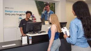 Comcast employee assisting customers.