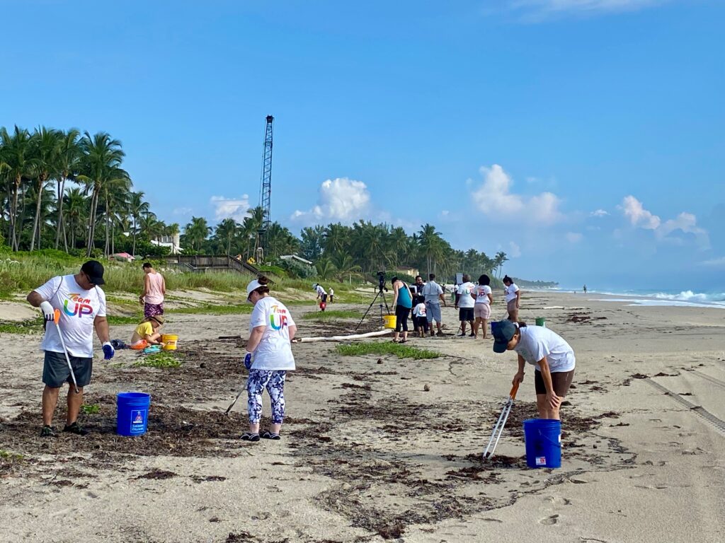 Comcast employees on beach in Palm Beach County