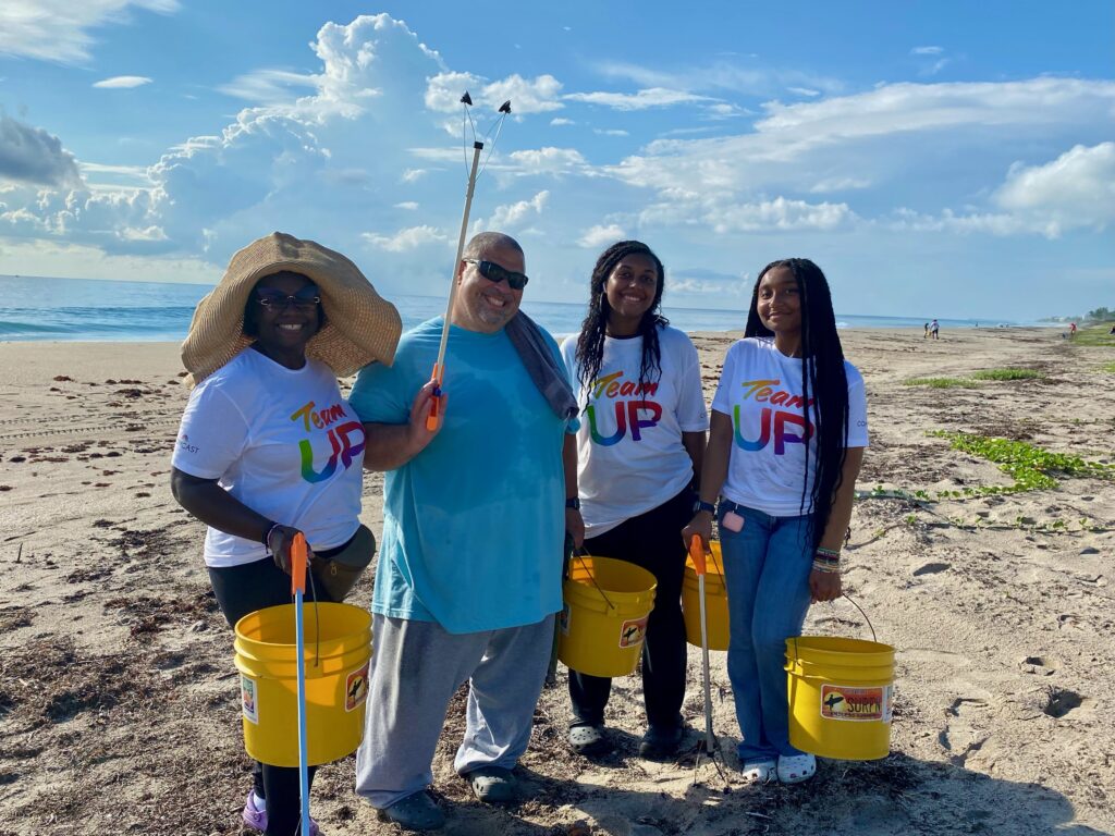 Comcast employees on beach in Palm Beach County