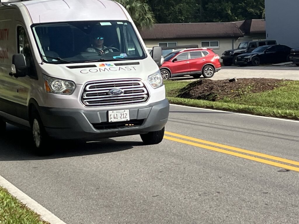 Comcast employee driving Xfinity WiFi van 