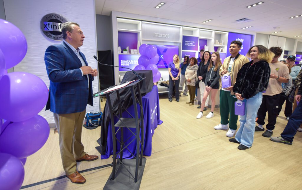 Comcast Florida's RSVP Jeff Buzzelli addresses the audience at the Sarasota County Xfinity store opening.