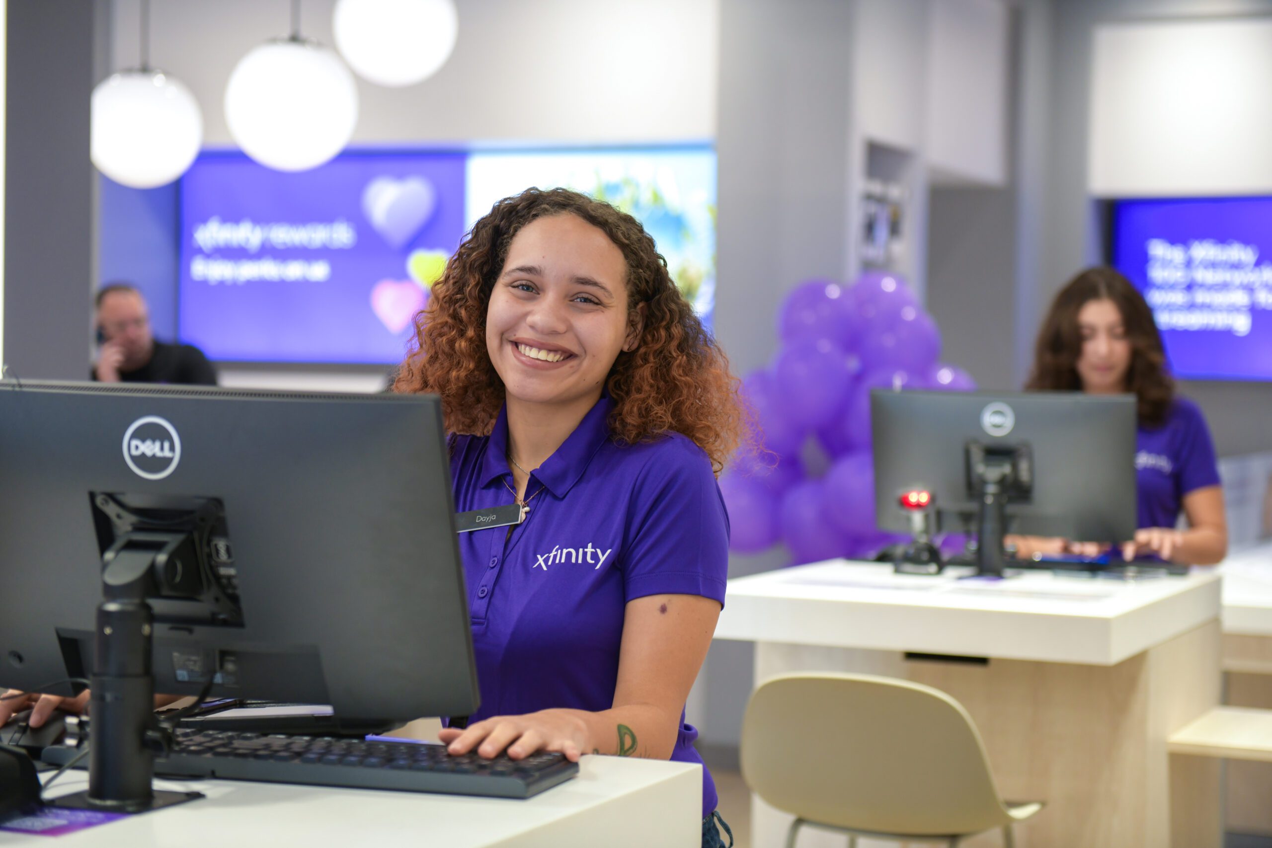 Woman working at an Xfinity Store