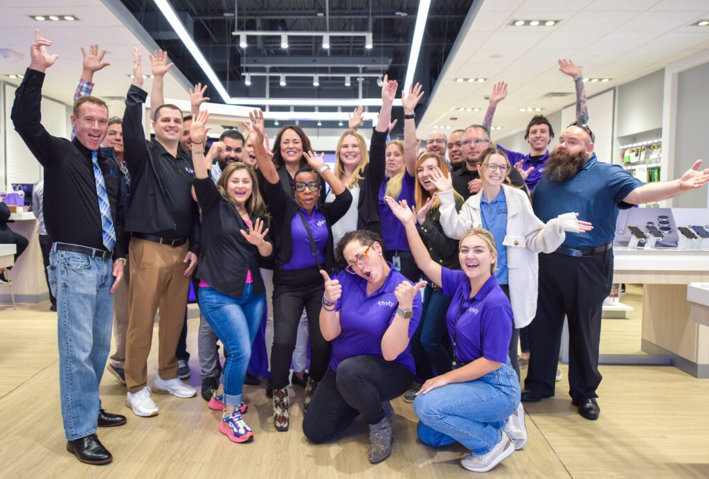 Crowd celebrating at store opening