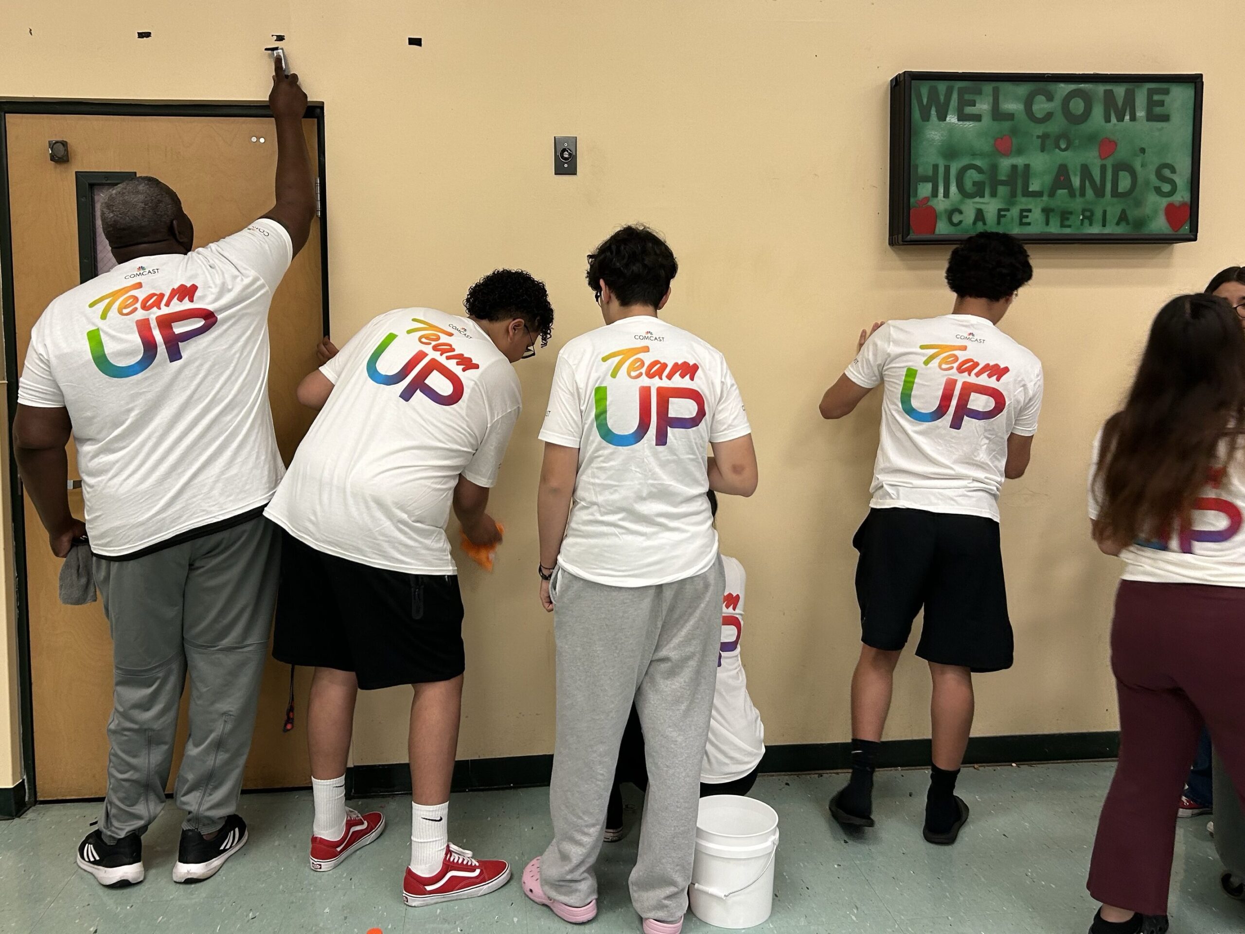 Volunteers cleaning up the walls