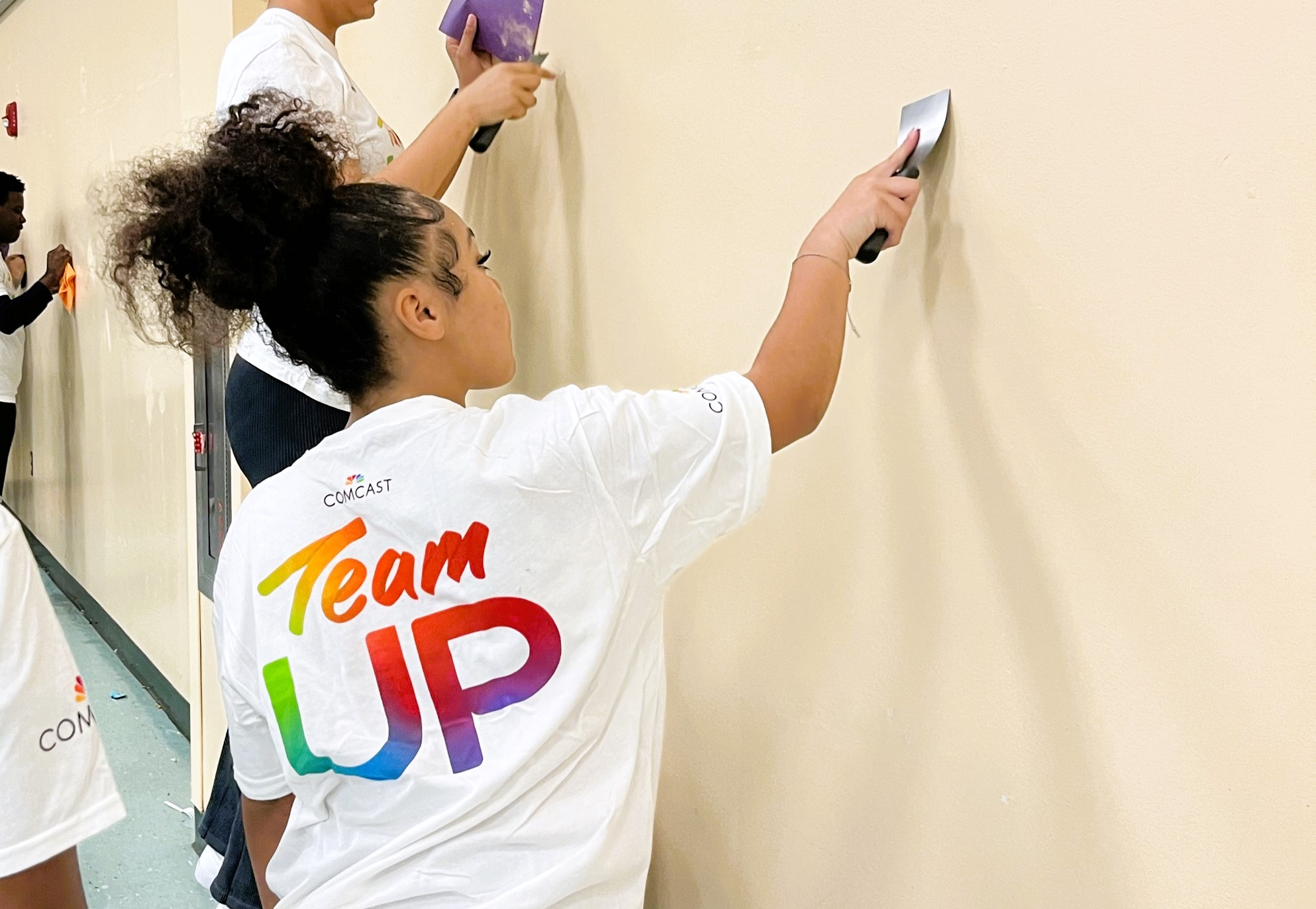 young woman scraping the wall