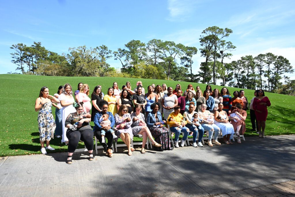 Women posing with babies