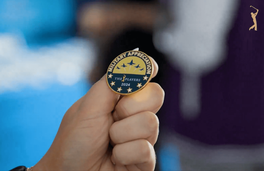 Person holding a military appreciation pin