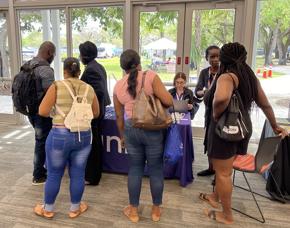 Xfinity workers talking to customers at an event