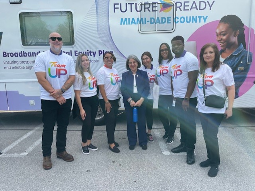 People posing with Miami Dade County Mayor, Daniella Levine Cava.