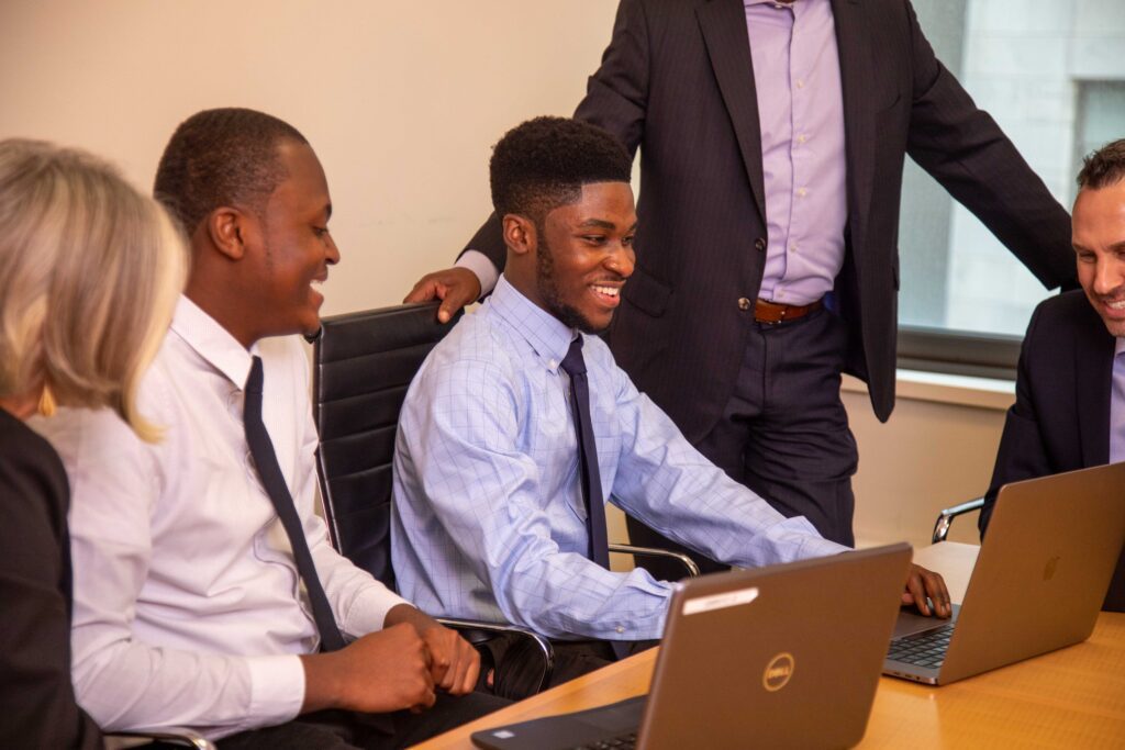 Students in a classroom working on a laptop