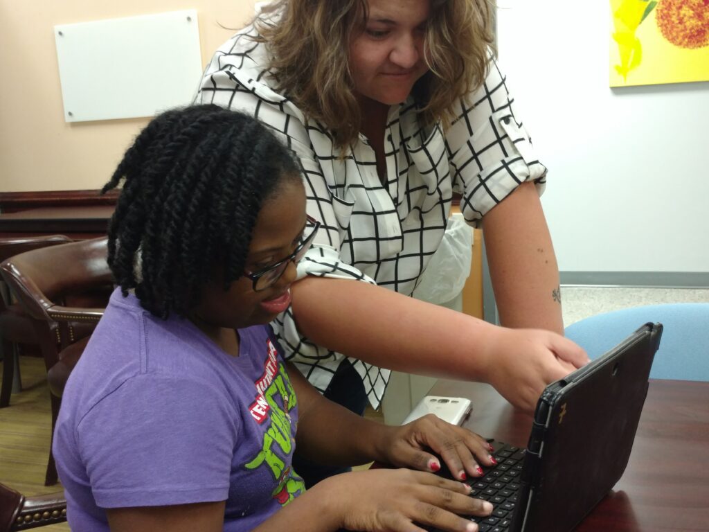 Student and teacher at The Arc.