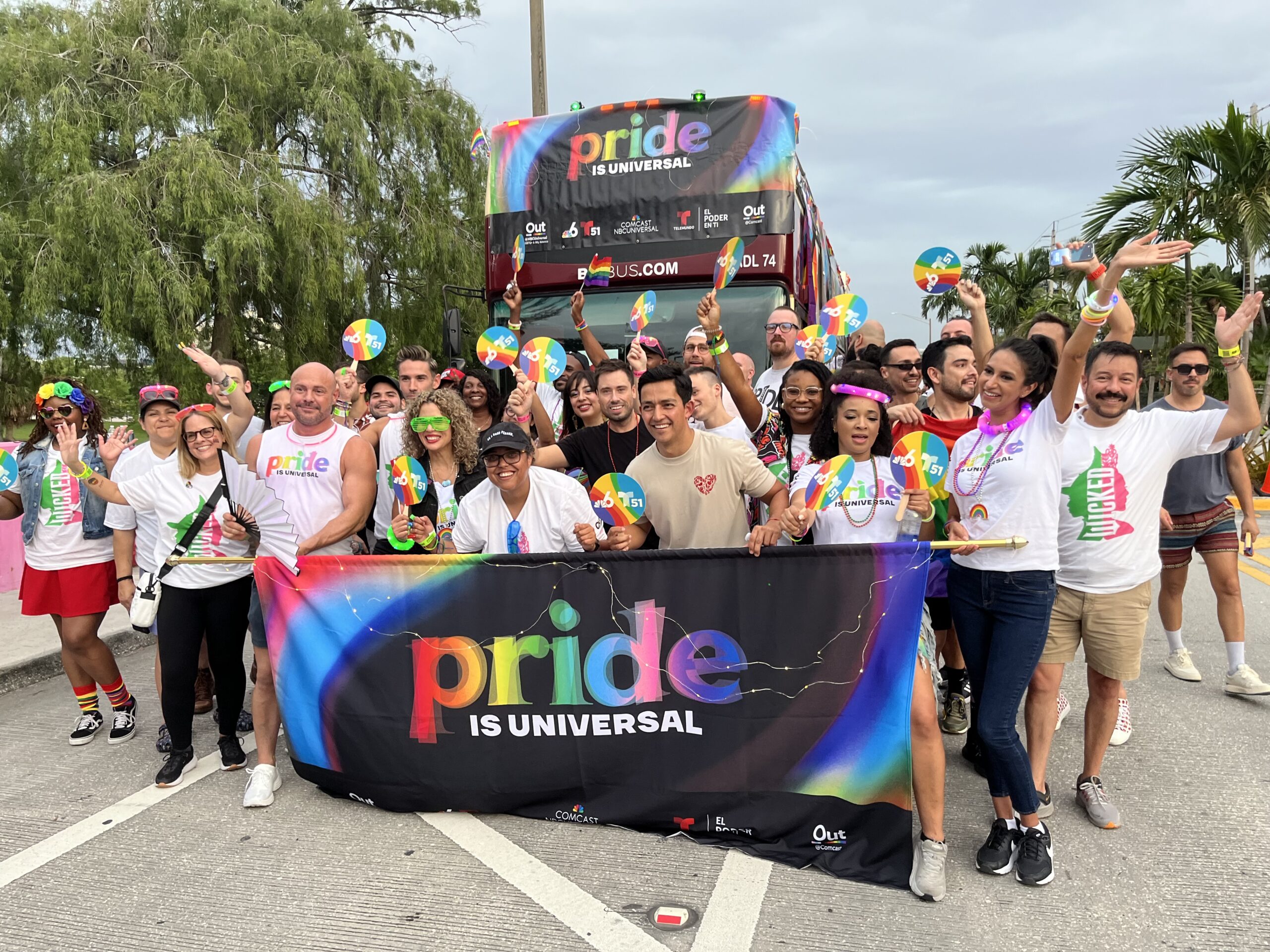 Group of people at a parade in front of a float