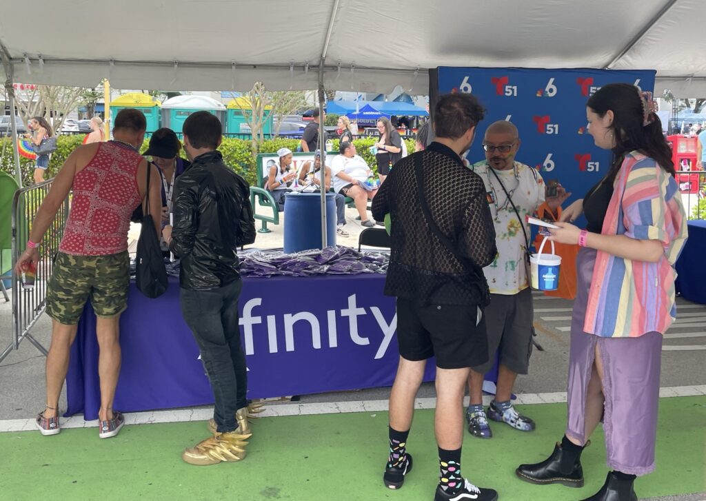 People talking at a booth