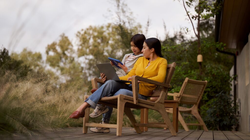 mom and child watching shows on tablets