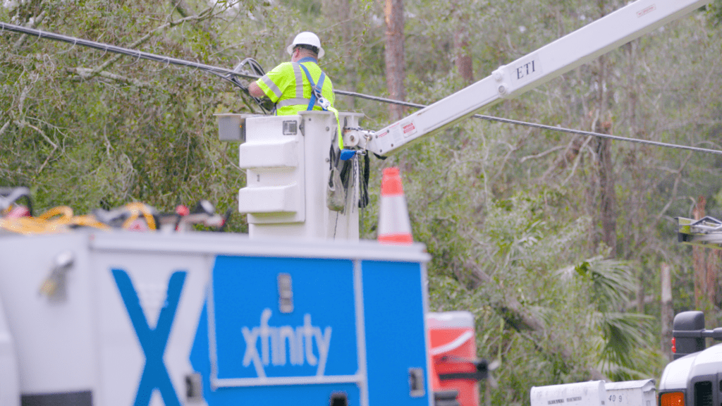 Xfinity tech working in a bucket truck