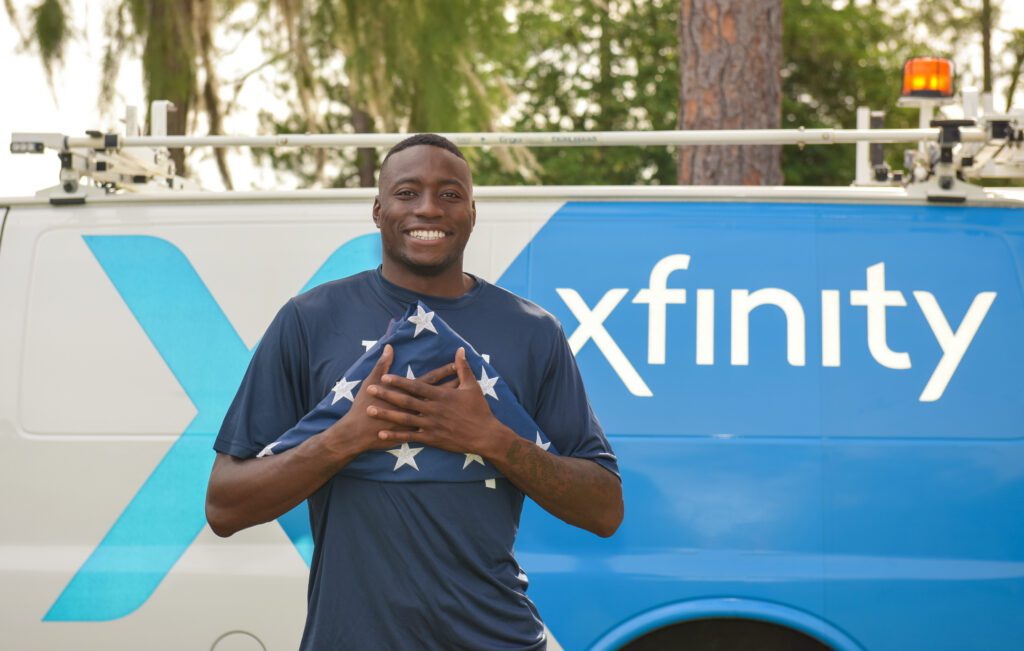 Grant Holloway participates in flag retirement ceremony.