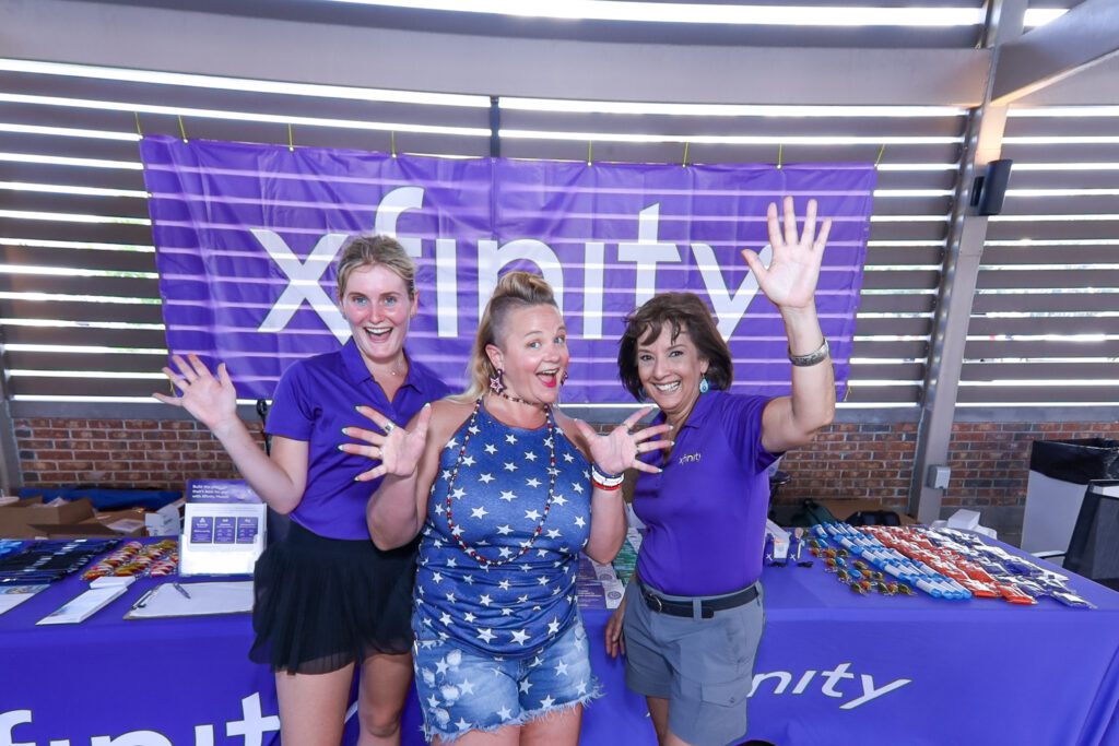 Xfinity representatives at the welcome table.